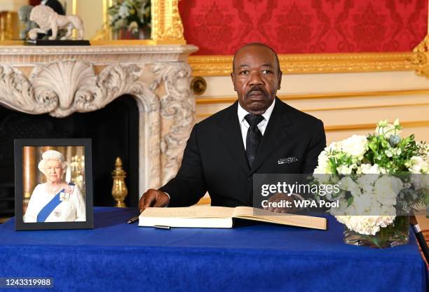 President of Gabon Ali Bongo Ondimba signs a book of condolence at Lancaster House on September 18, 2022 in London, United Kingdom. Queen Elizabeth...