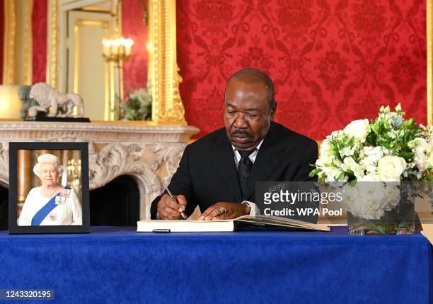 President of Gabon Ali Bongo Ondimba signs a book of condolence at Lancaster House on September 18, 2022 in London, United Kingdom. Queen Elizabeth...
