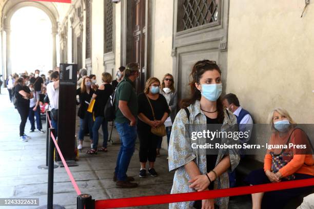 People queue waiting the Galleria degli Uffizi reopening after the Coronavirus lockdown at Galleria degli Uffizi on June 03, 2020 in Florence, Italy....