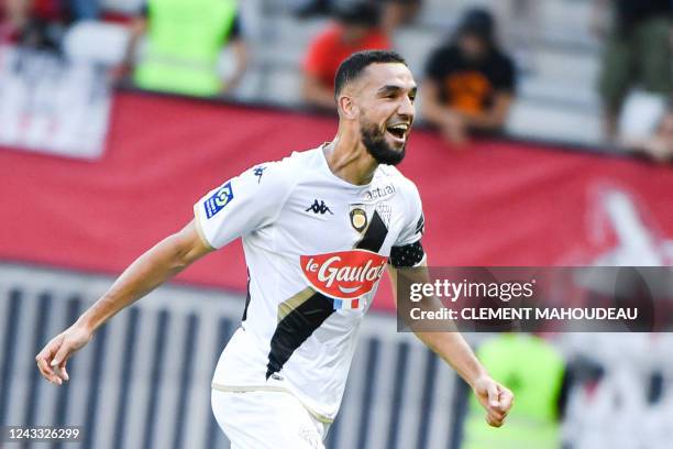 Angers' Algerian midfielder Nabil Bentaleb celebrates scoring his team's first goal during the French L1 football match between OGC Nice and SCO...