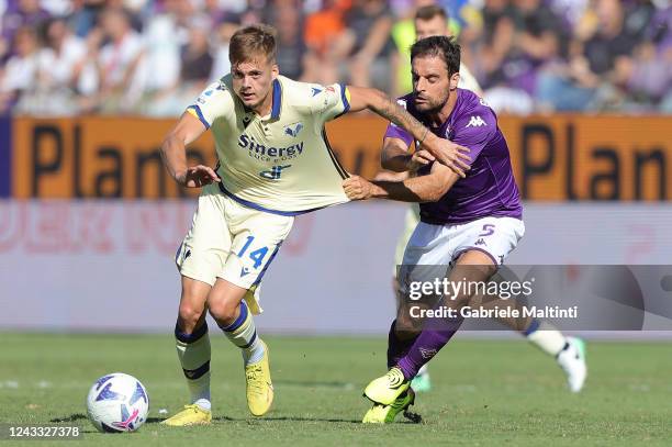 Ivan Ilic of Hellas Verona in action against Giacomo Bonaventura of ACF Fiorentina during the Serie A match between ACF Fiorentina and Hellas Verona...