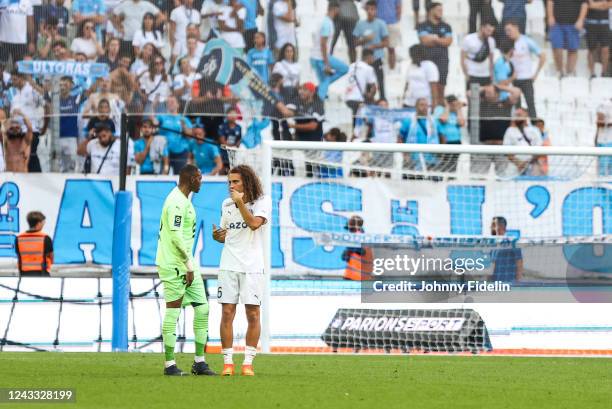 Steve MANDANDA of Rennes and Matteo GUENDOUZI of Marseille after the Ligue 1 Uber Eats match between Marseille and Rennes at Orange Velodrome on...