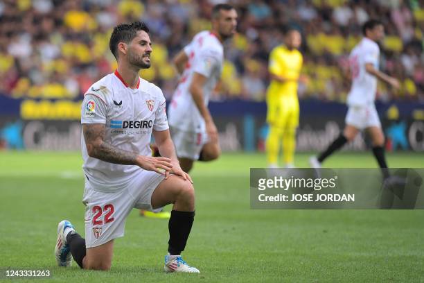 Sevilla's Spanish midfielder Isco reacts to missing a goal opportunity during the Spanish League football match between Villarreal CF and Sevilla FC...