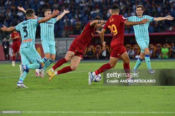 Roma's Italian midfielder Nicolo Zaniolo falls in the penalty area during the Italian Serie A football match between AS Roma and Atalanta Bergamo on...