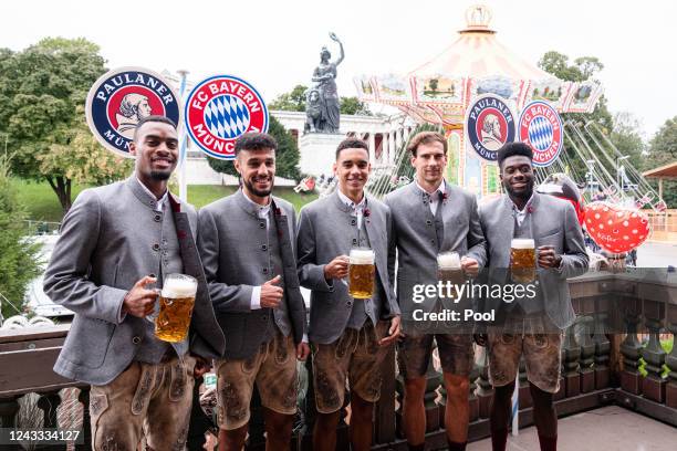 Ryan Gravenberch, Noussair Mazraoui, Jamal Musiala, Leon Goretzka and Alphonso Davies of FC Bayern Muenchen attend the Oktoberfest at Kaefer...