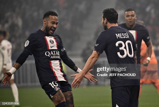 Paris Saint-Germain's Argentine forward Lionel Messi celebrates with Paris Saint-Germain's Brazilian forward Neymar after scoring a goal during the...