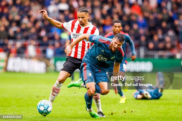 Armando Obispo of PSV Eindhoven and Oussama Idrissi of Feyenoord Rotterdam Battle for the ball during the Dutch Eredivisie match between PSV...