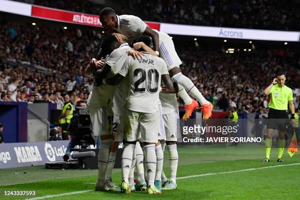 Real Madrid's players celebrate after the team second goal during the Spanish League football match between Club Atletico de Madrid and Real Madrid...
