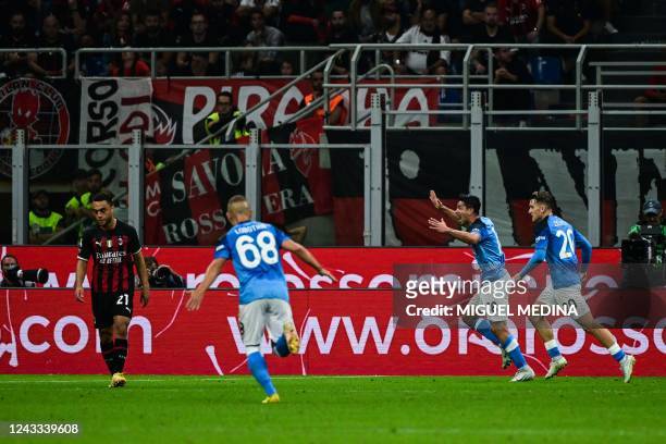 Napoli's Argentinian forward Giovanni Simeone celebrates after scoring during the Italian Serie A football match between AC Milan and Napoli on...
