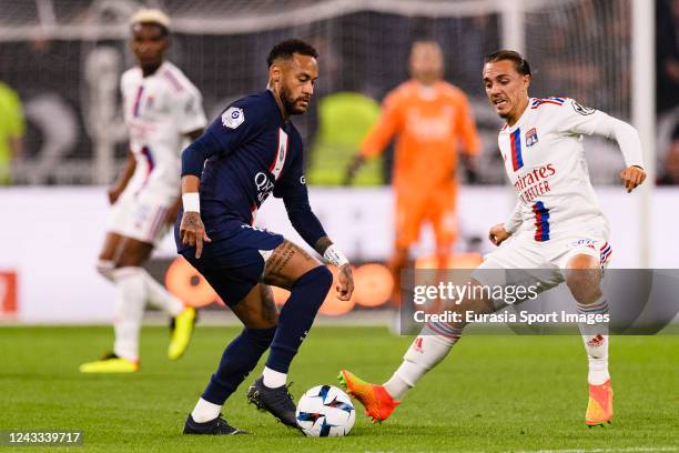 Neymar Junior of Paris Saint Germain dribbles Maxence Caqueret of Lyon during the Ligue 1 match between Olympique Lyonnais and Paris Saint-Germain at...