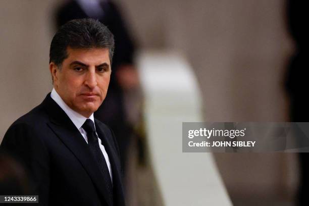 Nechirvan Barzani, President of Iraq's autonomous Kurdistan Region, pays his respects at the coffin of Queen Elizabeth II, Lying in State inside...