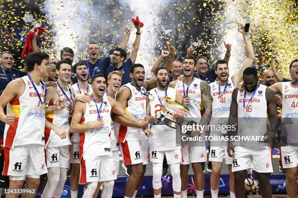 Spain's team celebrates with the trophy after the FIBA Eurobasket 2022 final basketball match between Spain and France in Berlin on September 18,...