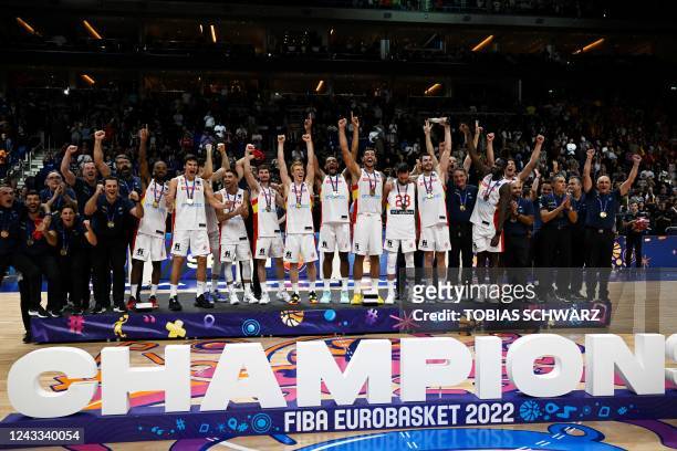 Spain's team poses with their gold medals after the FIBA Eurobasket 2022 final basketball match between Spain and France in Berlin on September 18,...