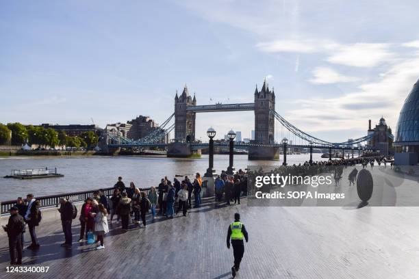 Large crowds continue to queue next to Tower Bridge on the last day of The Queen's lying-in-state at Westminster Hall. The Queen's state funeral...