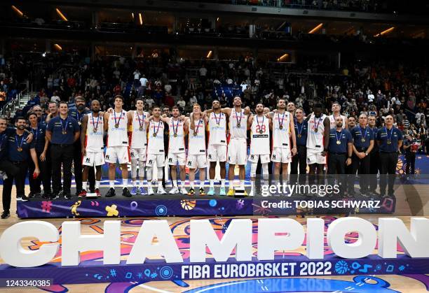 Spain's team poses with their gold medals after the FIBA Eurobasket 2022 final basketball match between Spain and France in Berlin on September 18,...