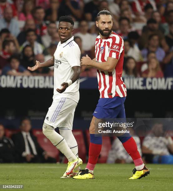 Vinicius Junior of Real Madrid in action against Felipe of Atletico Madrid during the Spanish La Liga week 6th soccer match between at the Spotify...