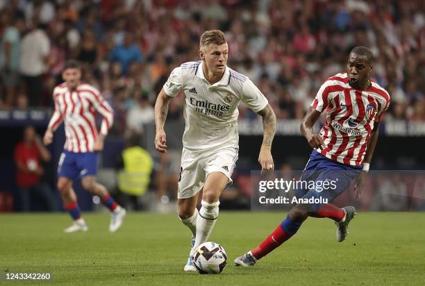 Toni Kroos of Real Madrid in action against Geoffrey Kondogbia of Atletico Madrid during the Spanish La Liga week 6th soccer match between at the...