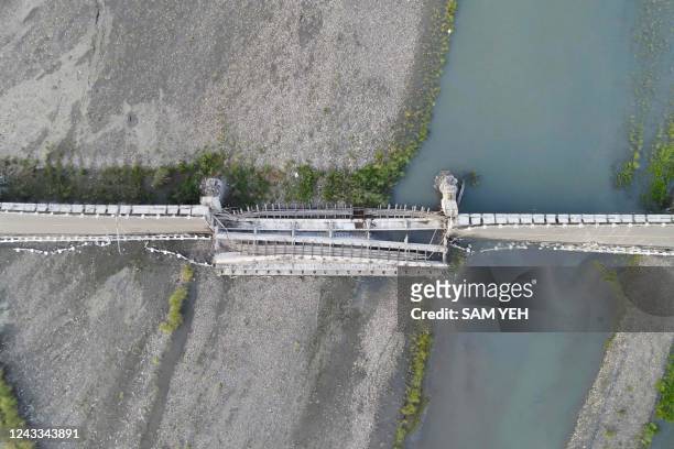 An aerial view shows the collapsed Kaoliao bridge in eastern Taiwan's Hualien county on September 19 following a 6.9 magnitude earthquake on...