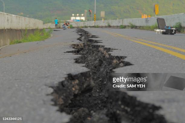 Fissure is seen along a road by the collapsed Kaoliao bridge in eastern Taiwan's Hualien county on September 19 following a 6.9 magnitude earthquake...