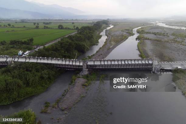 An aerial view shows the collapsed Kaoliao bridge in eastern Taiwan's Hualien county on September 19 following a 6.9 magnitude earthquake on...