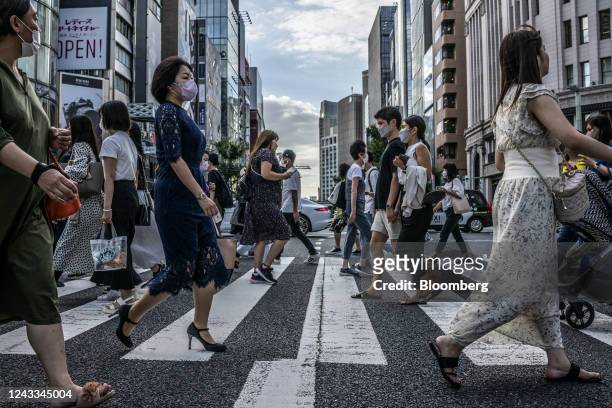 Pedestrians cross a road in Tokyo, Japan, on Saturday, Sept. 16, 2022. Japan is scheduled to release consumer price index on Sept. 20. Photographer:...