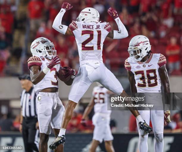 Kevin Knowles II and Greedy Vance of the Florida State Seminoles celebrate after the game winning interception against the Louisville Cardinals in...