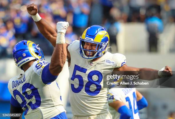 Los Angeles, CA Rams defensive lineman Aaron Donald, left, celebrates with fellow linebacker Justin Hollins after Hollins tackled Falcons quarterback...