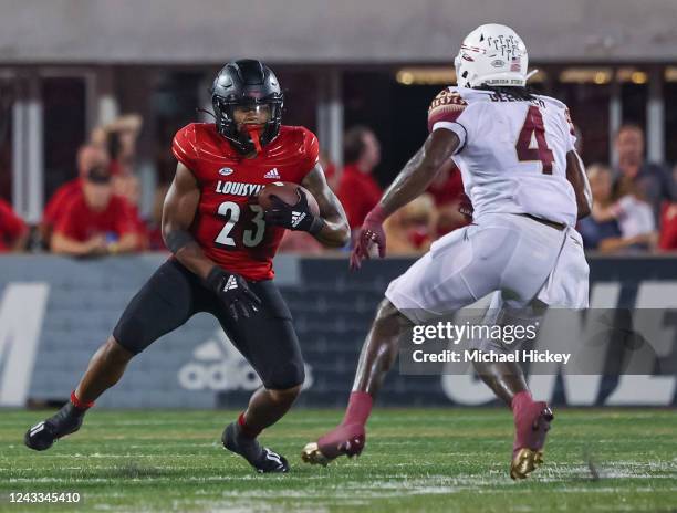 Trevion Cooley of the Louisville Cardinals runs the ball against the Florida State Seminoles at Cardinal Stadium on September 16, 2022 in Louisville,...