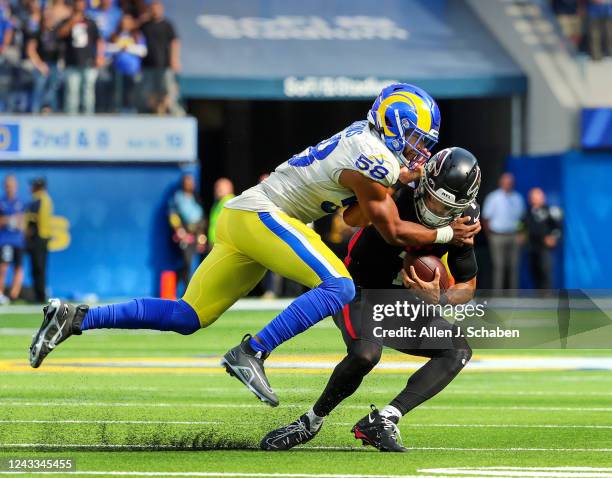 Los Angeles, CA Rams defensive lineman Justin Hollins tackles Falcons quarterback Marcus Mariota late in the fourth quarter at SoFi Stadium in Los...