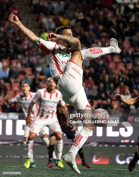 Necaxa's Edgar Mendez misses a shot during the Mexican Apertura 2022 tournament football match between Tijuana and Necaxa at the Caliente stadium in...