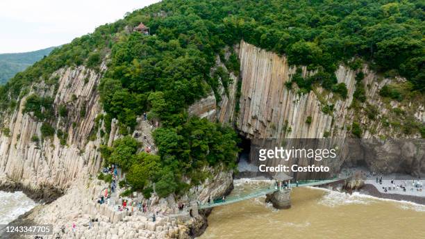 Tourists visit Hua 'ao Stone Forest scenic spot in Ningbo, Zhejiang province, China, Sept 18, 2022. Hua 'ao Stone Forest is a rare fused tuff. Hua...