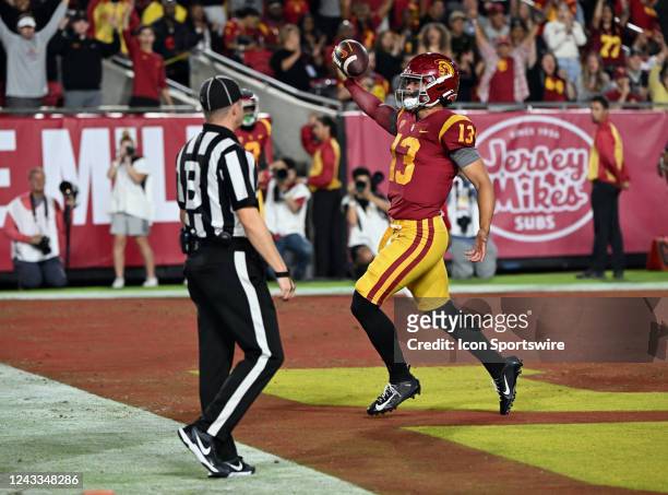 Trojans quarterback Caleb Williams celebrates after running for a touchdown in the first half of an NCAA football game against the Fresno State...