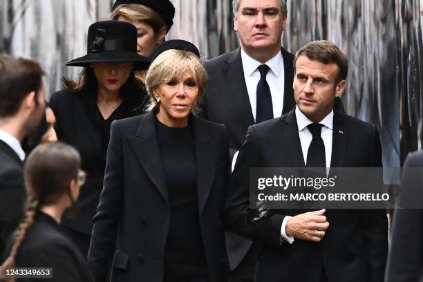 French President Emmanuel Macron and his wife Brigitte Macron arrive at Westminster Abbey in London on September 19 for the State Funeral Service for...