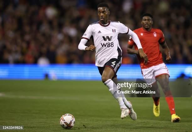 Tosin Adarabioyo of Fulham in action with Taiwo Awoniyi of Nottingham Forest during the Premier League match between Nottingham Forest and Fulham FC...