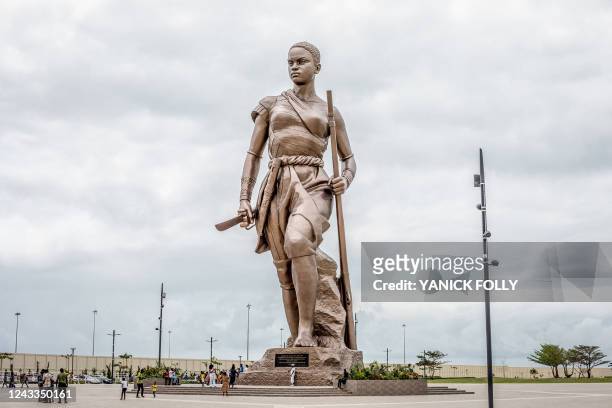 Giant 30-metre high bronze statue representing an Amazon is seen in central Cotonou on September 17, 2022 as a symbol of national identity and key...