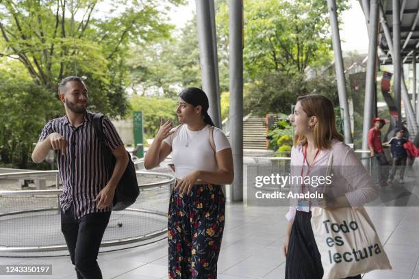 Members of deaf community Sebastian Arenas and Geraldyne Zapata visit the explora park aquarium accompanied by Marian Antonia Soto who works in the...