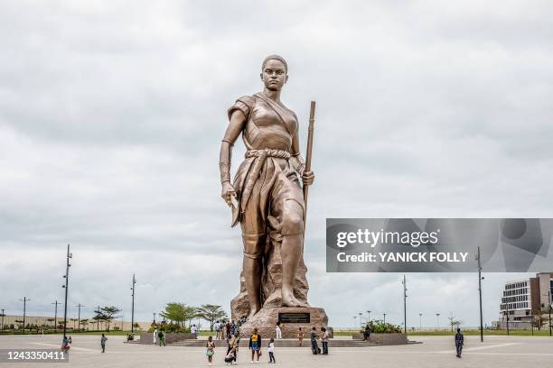 Giant 30-metre high bronze statue representing an Amazon is seen in central Cotonou on September 17, 2022 as a symbol of national identity and key...