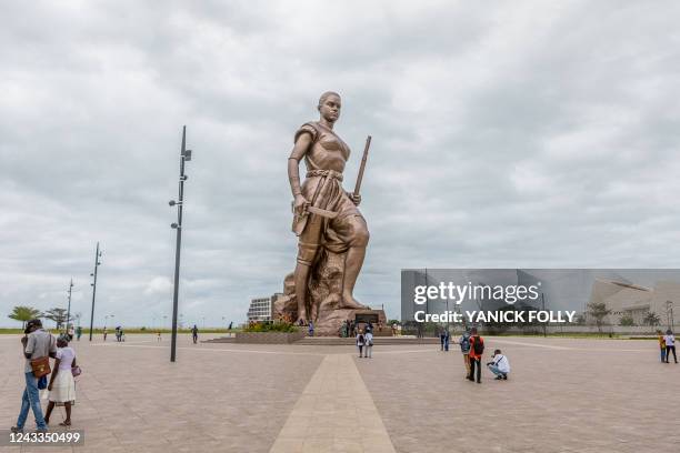 Giant 30-metre high bronze statue representing an Amazon is seen in central Cotonou on September 17, 2022 as a symbol of national identity and key...