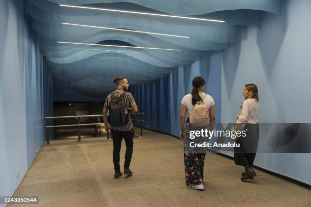 Members of deaf community Sebastian Arenas and Geraldyne Zapata visit the explora park aquarium accompanied by Marian Antonia Soto who works in the...