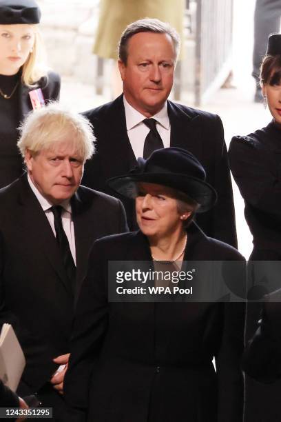 Former UK prime ministers David Cameron, Boris Johnson and Theresa May arrive at the State Funeral of Queen Elizabeth II, held at Westminster Abbey,...
