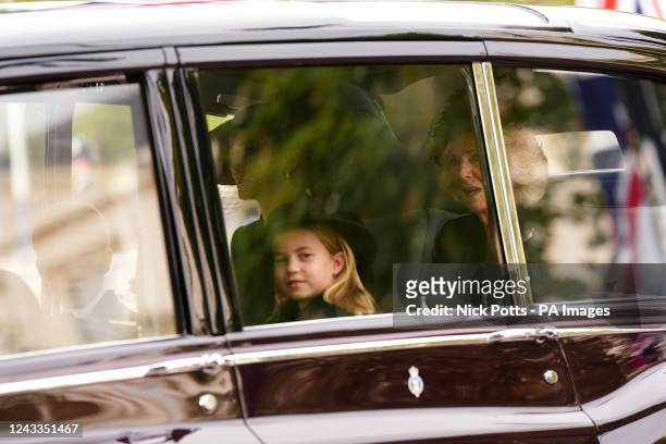 The Queen Consort, the Princess of Wales, Princess Charlotte and Prince George on Horse Guards Road as they arrive for the State Funeral of Queen...