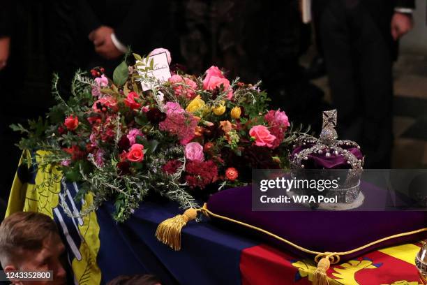Message by King Charles III is left on the coffin of Queen Elizabeth II as it is carried into Westminster Abbey for the State Funeral on September...