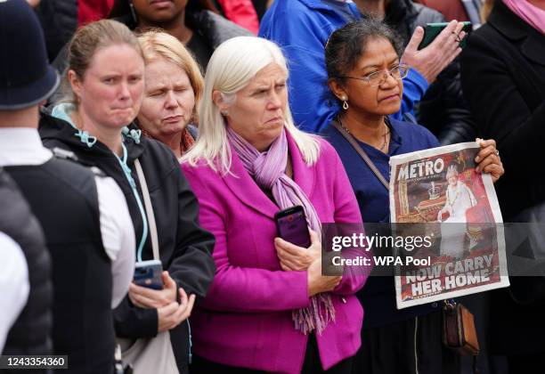 Members of the public react to the Horse Guards Avenue during the funeral procession ahead of the State Funeral of Queen Elizabeth II at Westminster...