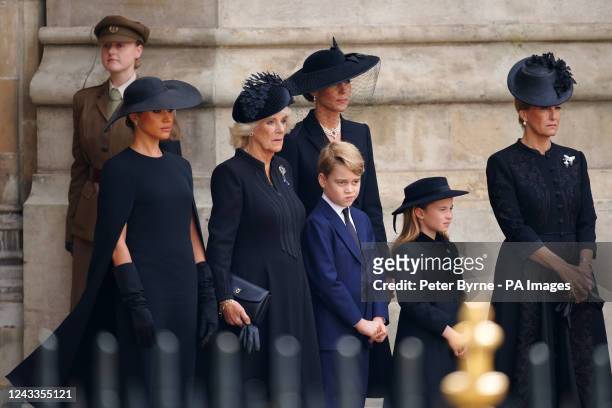 The Duchess of Sussex, the Queen Consort, Prince George, the Princess of Wales, Princess Charlotte and the Countess of Wessex leaving the State...