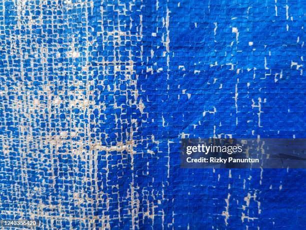 full frame of old blue tarpaulin - aquamarin edelstein stock-fotos und bilder