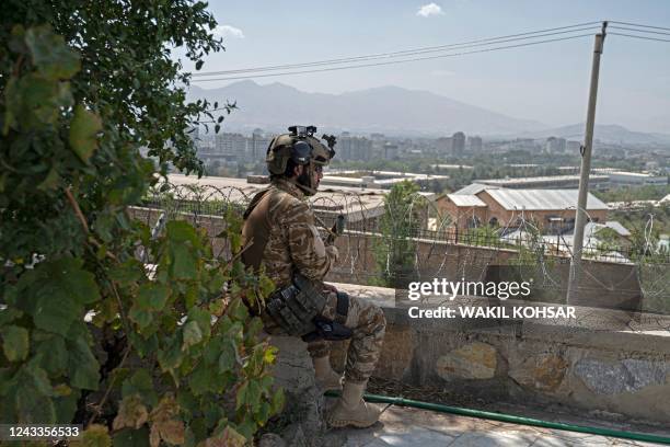 Taliban fighter keeps vigil near the Intercontinental Hotel during a press event organised by the members of the Taliban, in Kabul on September 19,...