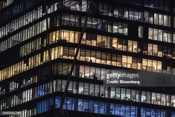 Illuminated offices in the Dubai International Financial Centre district of Dubai, United Arab Emirates, on Friday, Sept. 16, 2022. Office rents in...