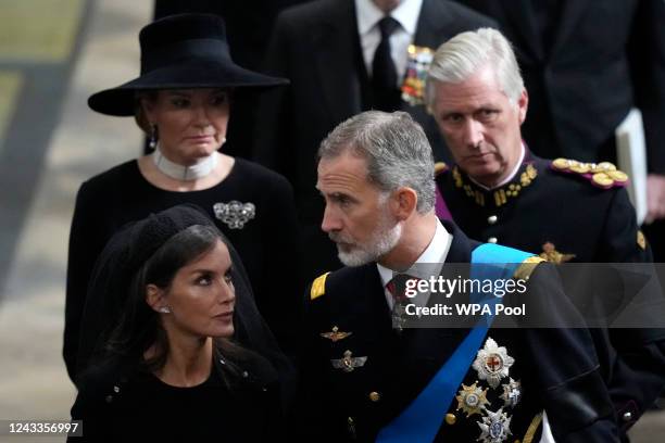 Spain's King Felipe VI and Queen Letizia and Belgium's King Philippe and Queen Mathilde follow the coffin of Queen Elizabeth II as it is carried out...
