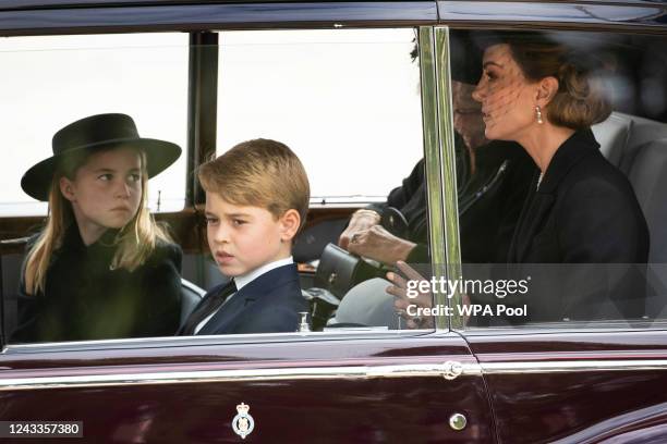 Camilla, Queen Consort, Catherine, Princess of Wales, Prince George of Wales, Princess Charlotte of Wales follow the cortège of the late Queen...