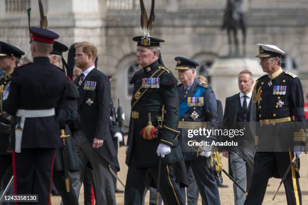 Prince Harry, Duke of Sussex attends the ceremony as the coffin of Queen Elizabeth II, adorned with a Royal Standard and the Imperial State Crown and...